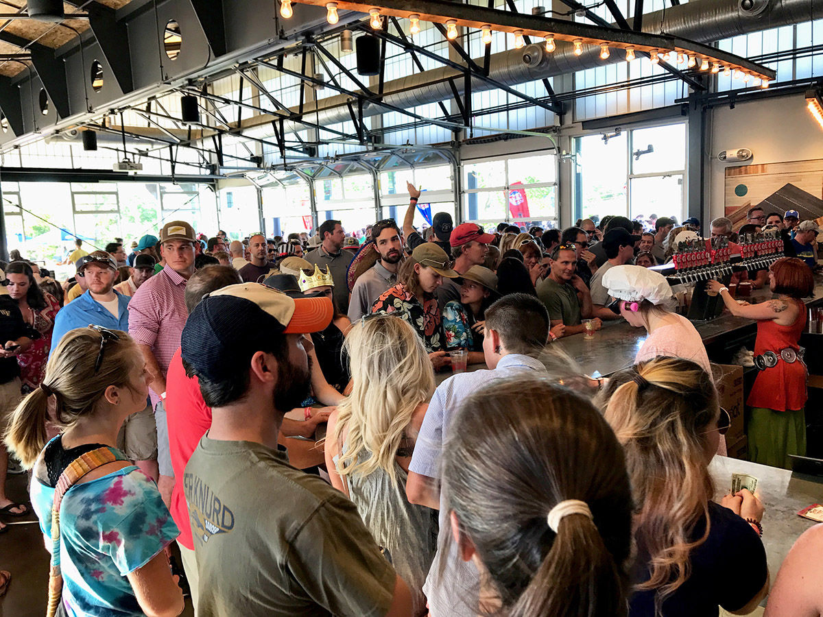 Tour de Fat festival goers in New Belgium Asheville's Liquid Center
